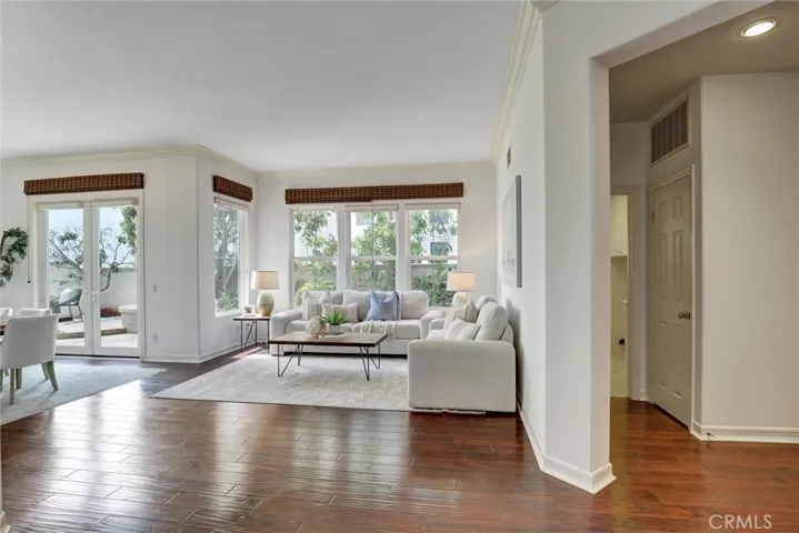 The living room opens naturally to the dining area, making everyday living and entertaining effortless.