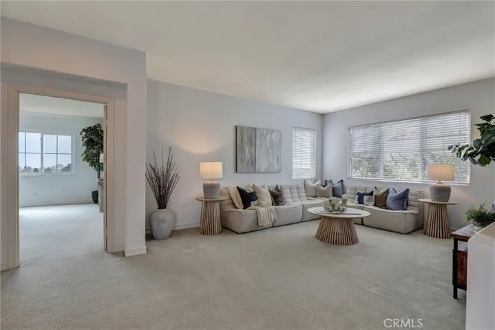 The spacious upstairs loft provides a versatile living area ideal for a family room, home office, or media space.
