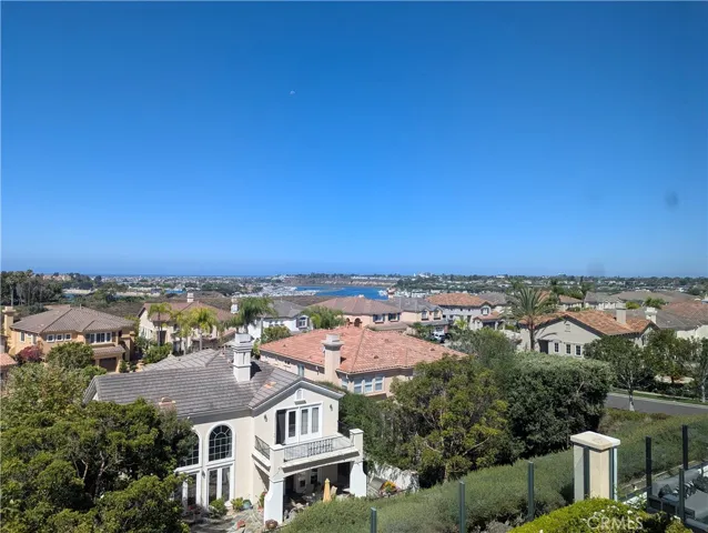Sweeping views across the Upper Newport Bay, Newport Harbor and the Pacific Ocean.