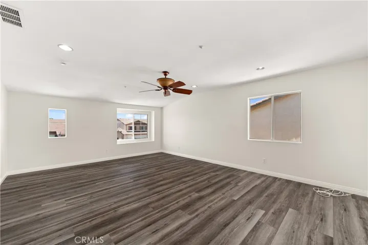 Bonus room with several windows and open space ready for a new pool table!