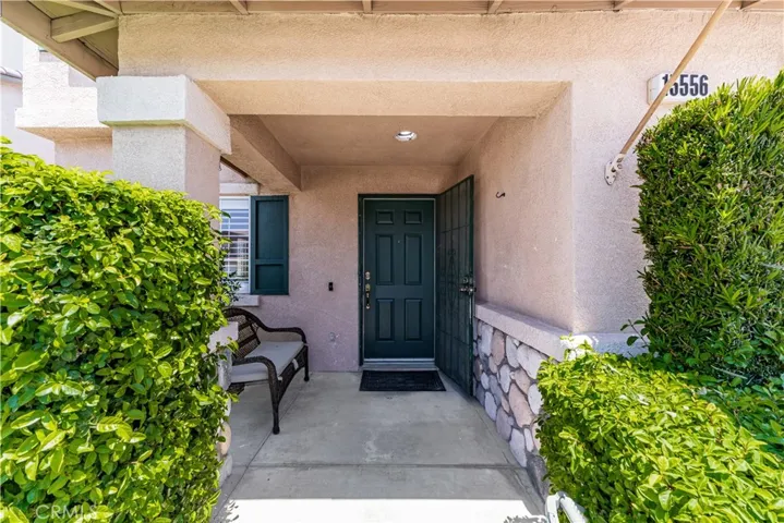 Front door with a welcome bench.