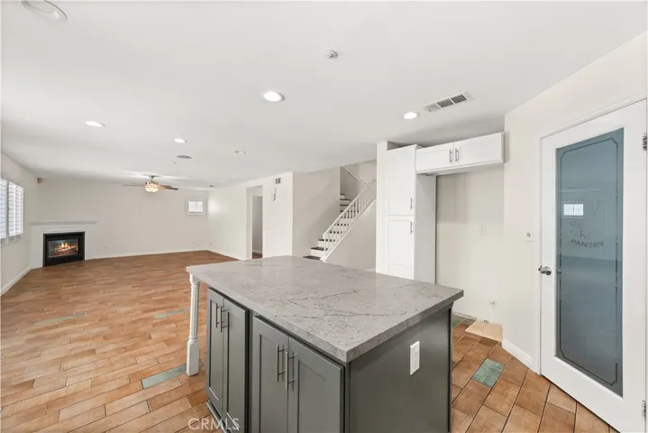 Kitchen with family room beyond.