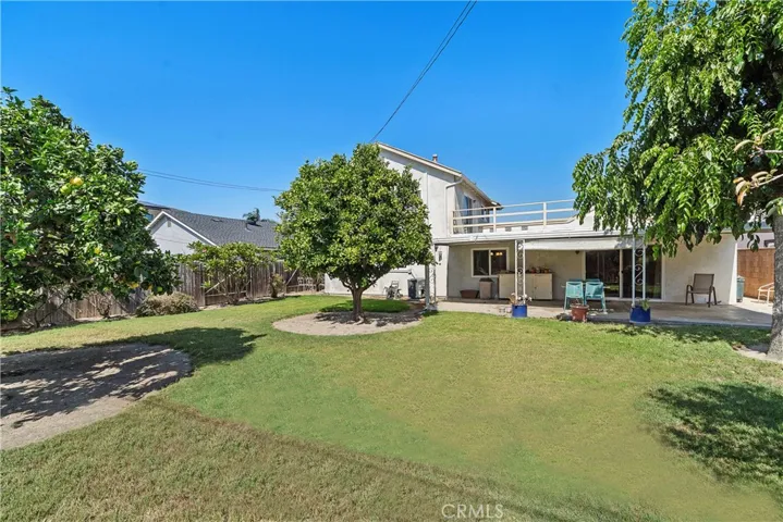 Large Rooftop Deck Overlooks Expansive Backyard