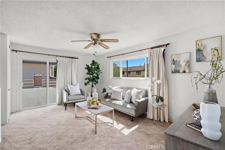 Upstairs Family Room with Slider that Opens to Rooftop Deck