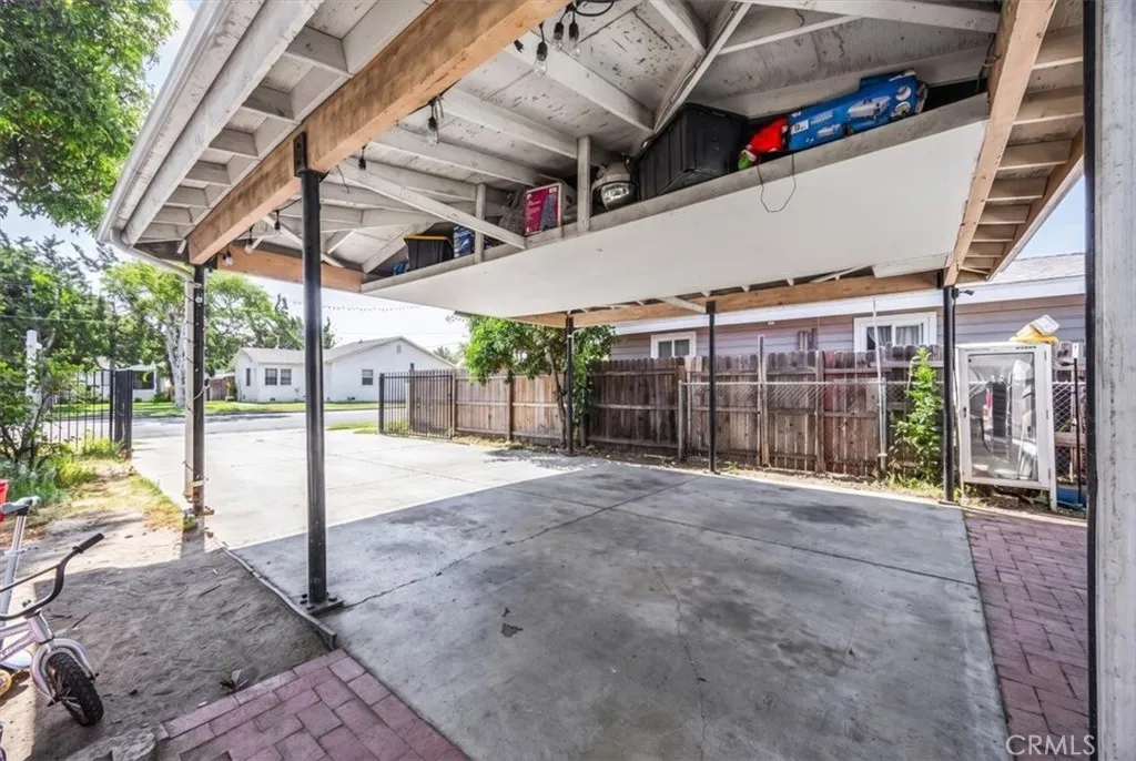 Covered storage in carport ceiling