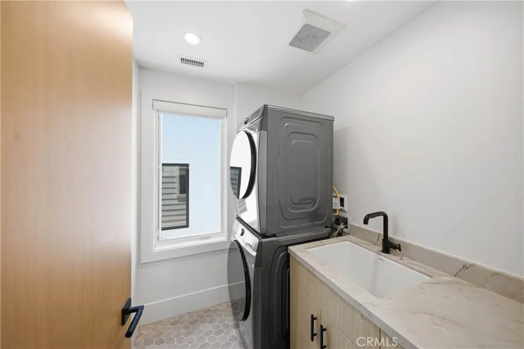 Laundry room located in upper level