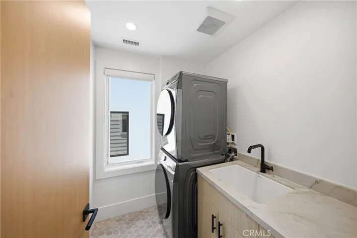 Laundry room located in upper level