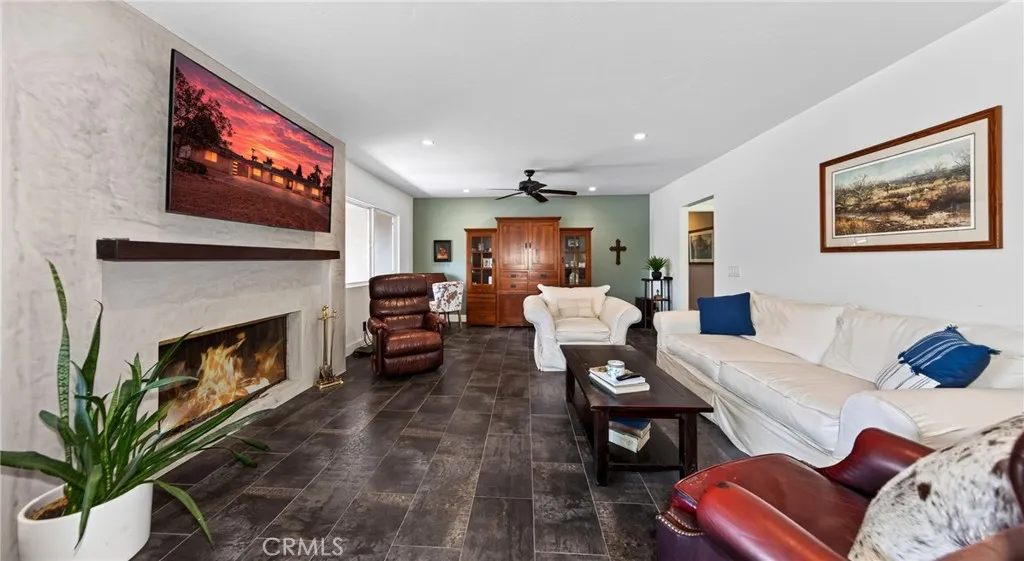 Front family room with fireplace. Flooring is ceramic tile.