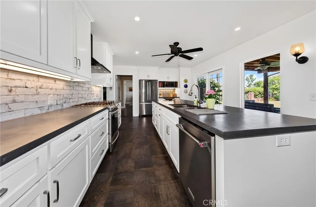 kitchen... counter tops are quarts, flooring ceramic tile and stainless appliances all stay with the home.