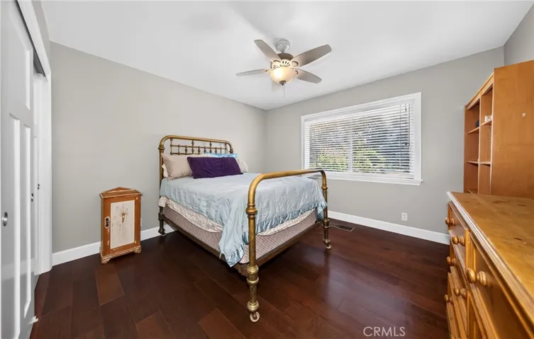 Bedroom with hardwood flooring