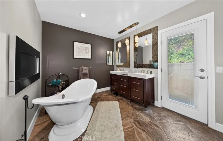 Beautifully redone primary bath. Side door goes to side of house with cement walkway to​​‌​​​​‌​​‌‌​​‌​​​‌‌​​​‌​​‌‌​​‌‌​​‌‌​​​​ backyard.