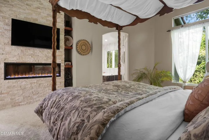Upstairs Primary Bedroom w/ Fireplace