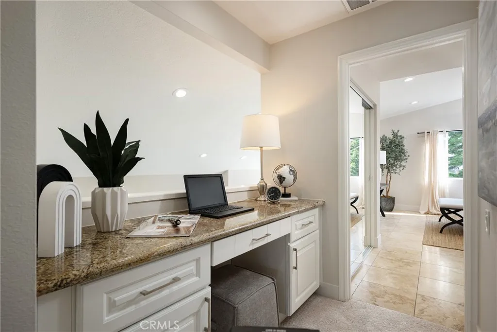 Built-in computer workstation with drawers conveniently located in the upstairs hallway, providing the perfect space for working from home or studying.