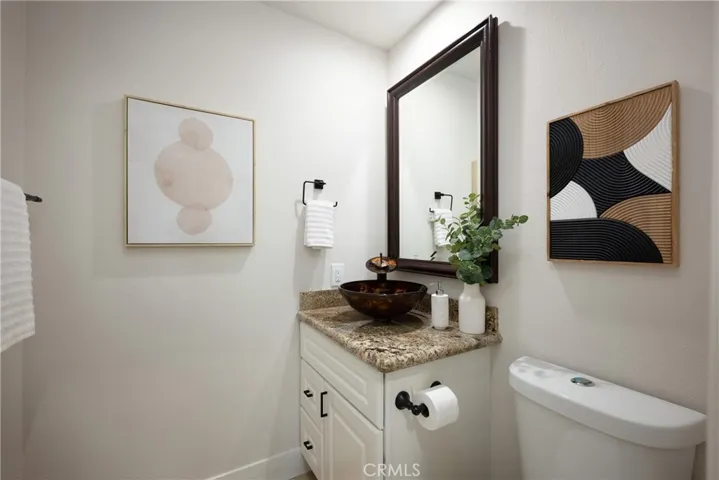 Upgraded guest bathroom conveniently located downstairs.
