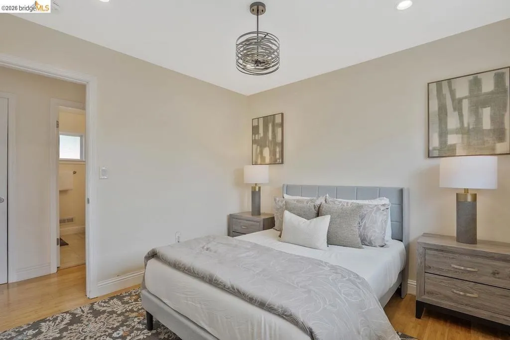 Bedroom featuring light wood-finish flooring and neutral wall tones