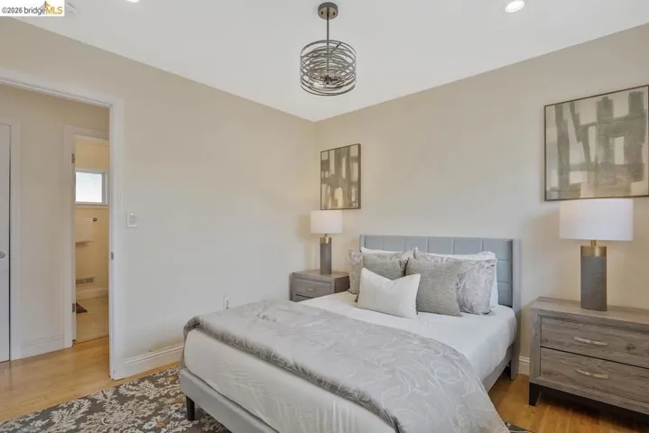 Bedroom featuring light wood-finish flooring and neutral wall tones