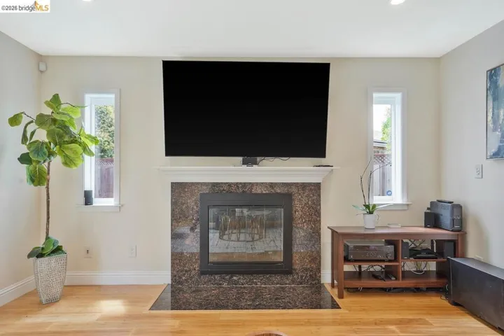 Living space featuring light wood-finish flooring and recessed ceiling lights