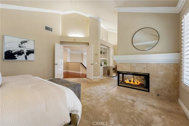 Primary suite photo has been digitally enhanced