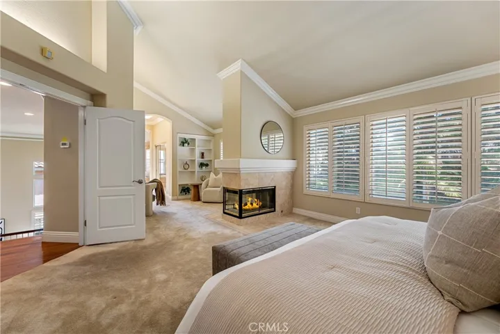 Primary suite photo has been digitally enhanced