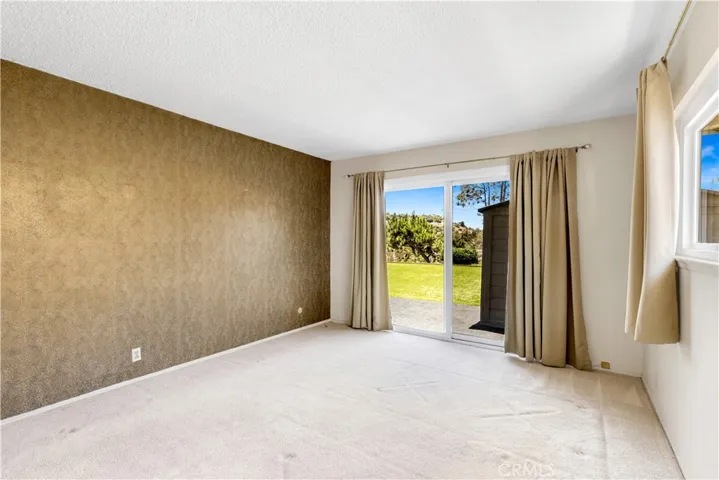 Primary Bedroom with access to the backyard.
