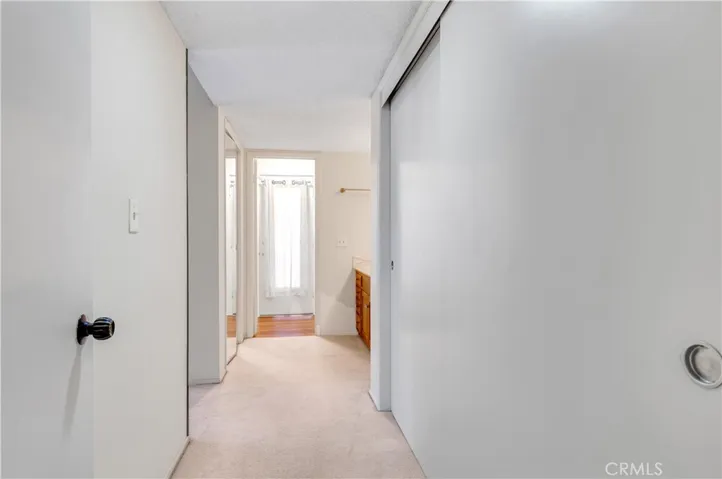 Dressing area with dual closets.