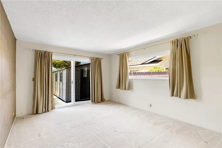 Primary Bedroom with newer double pane windows and doors.