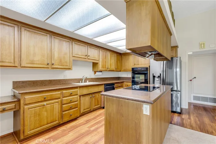 Abundant cabinet storage with lovely granite countertops.