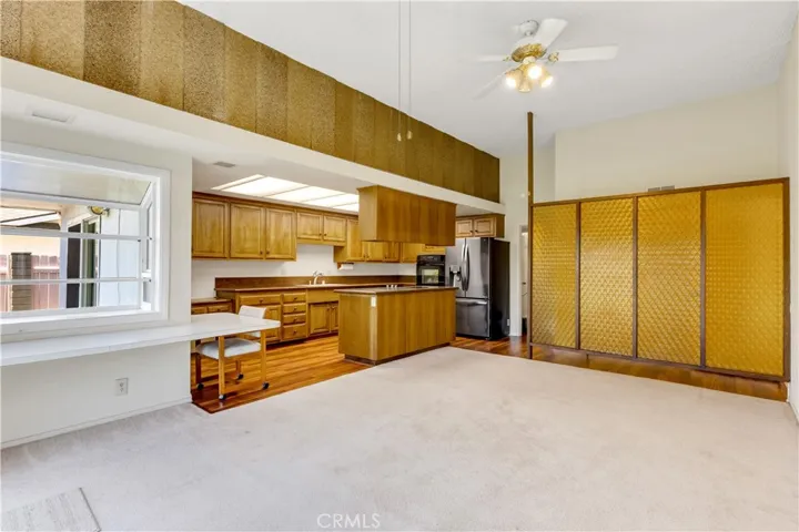 Large family room with eat in kitchen and garden window.