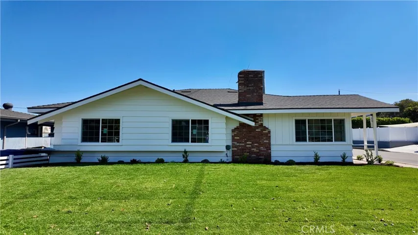 Front of House w/ New Sod and Ranch Style Vinyl Fence Coming Soon