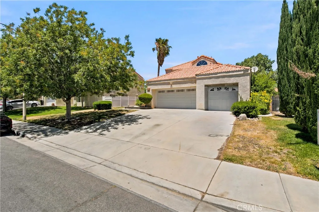 3 Car Garage with wide driveway.