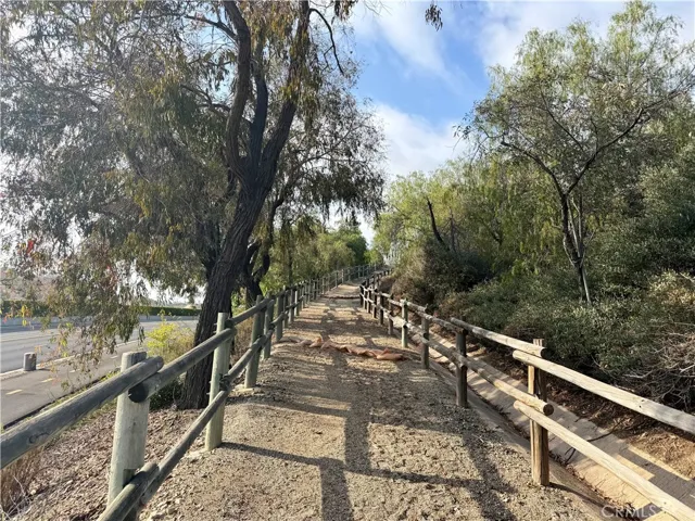 Trail leads down to the street below and walking trail.