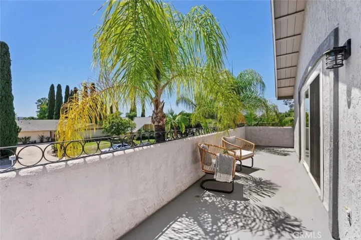 An excellent spot for morning coffee, the balcony provides plenty of room for outdoor seating and captures scenic neighborhood views.