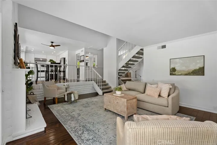 Looking back from the family room, the open-concept split-level layout perfectly showcases the transition up to the kitchen and foyer.