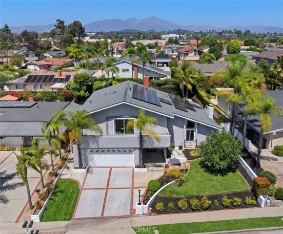 This dramatic high-angle shot showcases the property’s excellent street presence, pristine landscaping, and the modern solar panel installation on the roof.

*Parts of the grass have been digitally enhanced.*