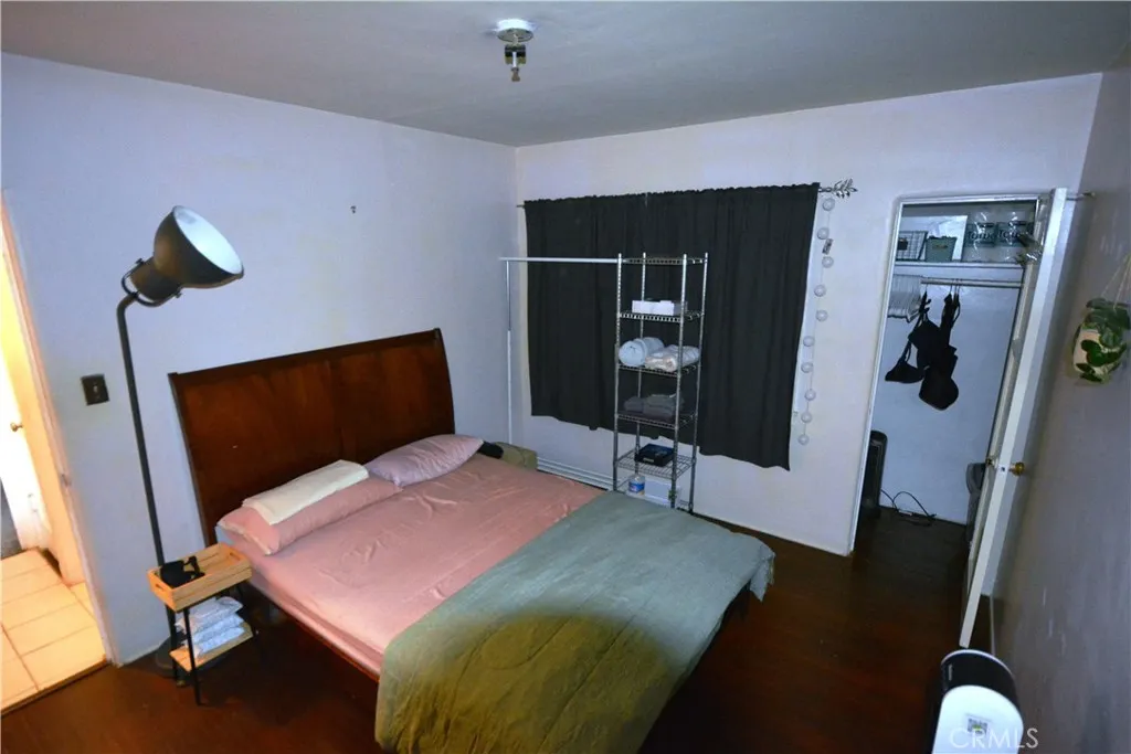 This bedroom number 2 has a spacious closet and hardwood floors
