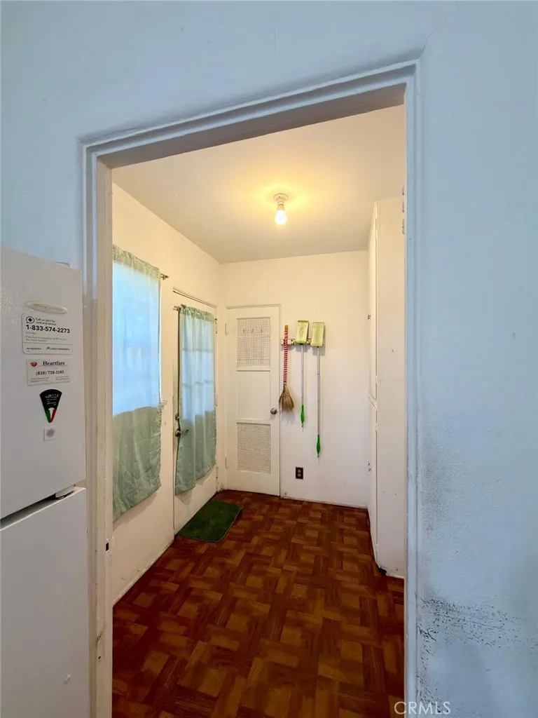 View of utility room which can be a walk-in pantry or second laundry room