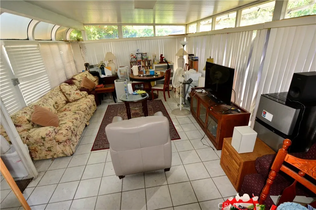 This stand-alone solarium is perfect party room, a separate guest quarters or future pool house!