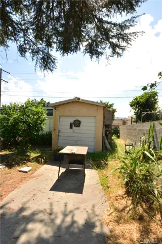 a separate 1 car garage (currently being used as storage)