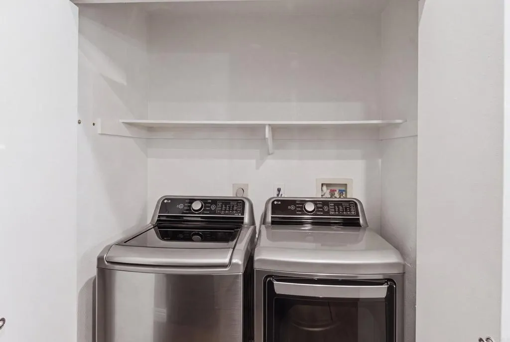 Beautiful full size side by side stainless washer/dryer.