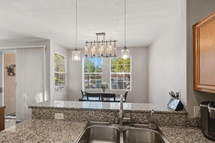 Sliding glass doors between LR and DR to patio.l