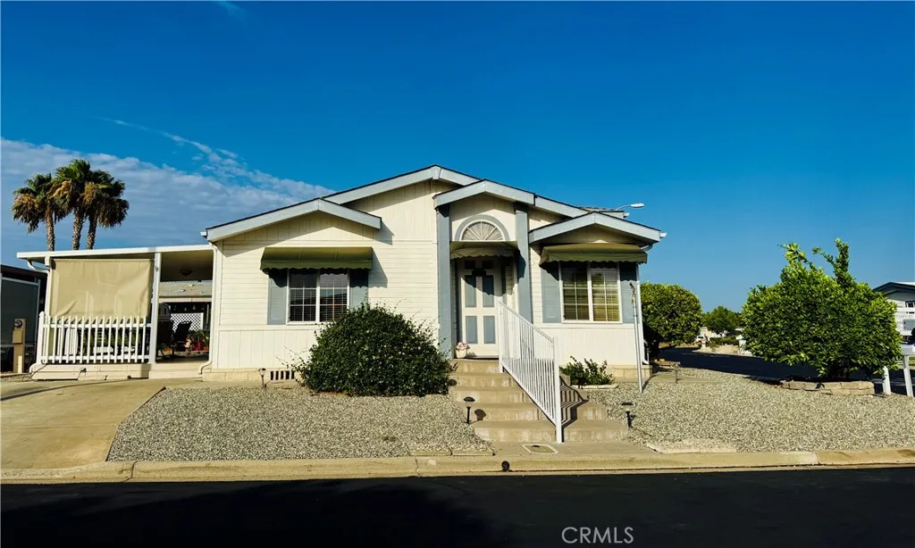Large corner lot with three fruit trees and easy to maintain spaces.