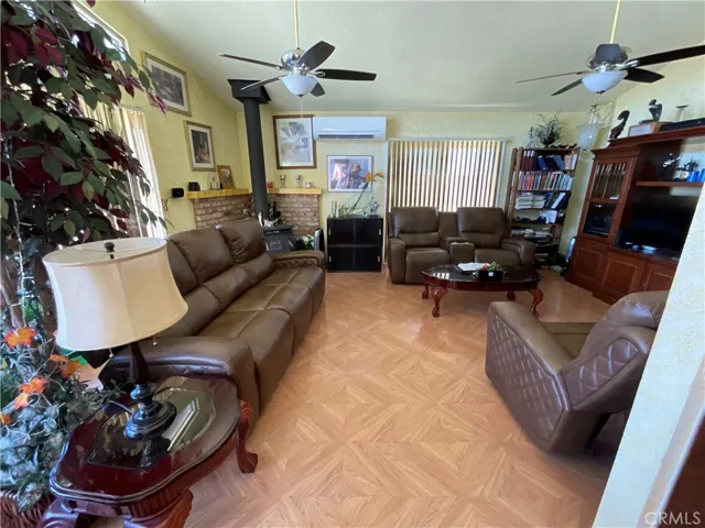 Living room open to dining area and kitchen with view of the canal waters of Clear Lake