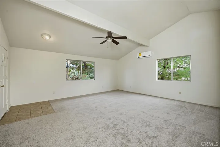 Large living area with vaulted ceiling and mini-split heat/ac.