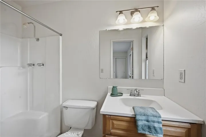 Primary bathroom with step in shower.