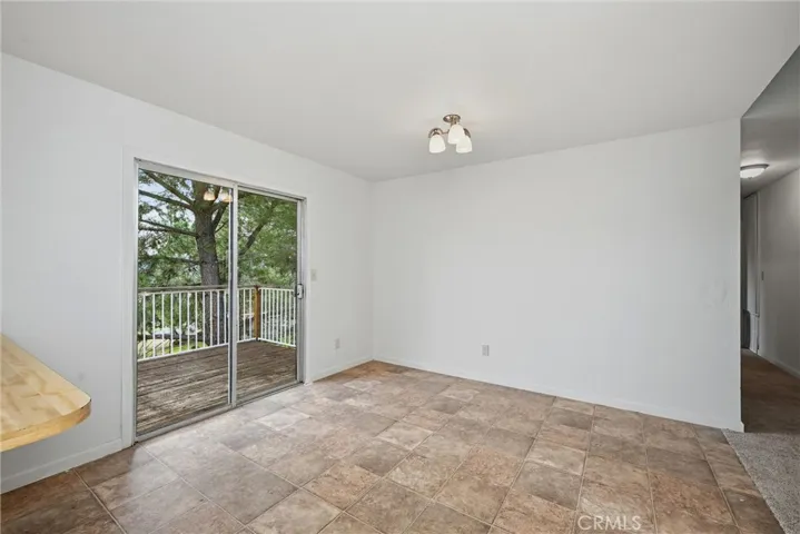 Dining area has slider to back deck.