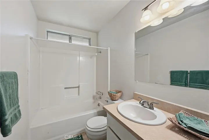 Hall bath with shower over tub.