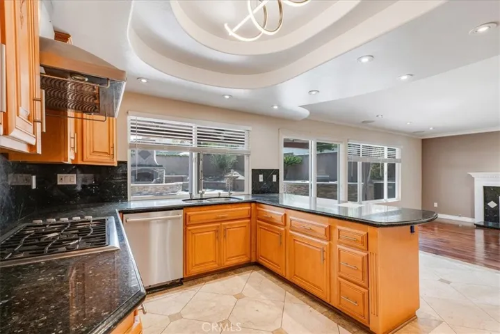 Upgraded kitchen with view to rear yard
