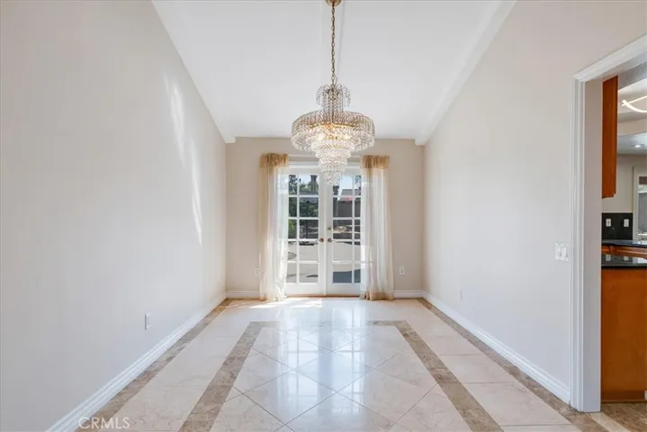 Beautiful dining room with French doors leading to the rear​​‌​​​​‌​​‌‌​​‌​​​‌‌​​​‌​​‌‌​​‌‌​​‌‌​​​​ yard.