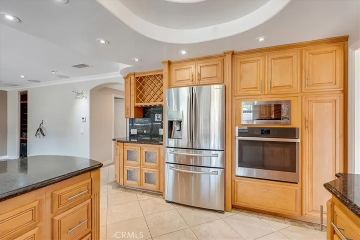 Another view of kitchen with stainless steel appliances.