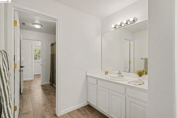 Bathroom vanity with a white countertop and integrated sink